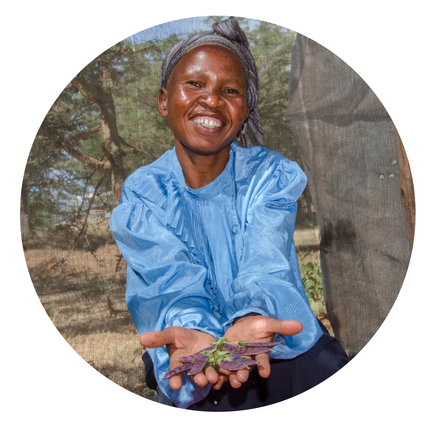 A worker holding fresh produce