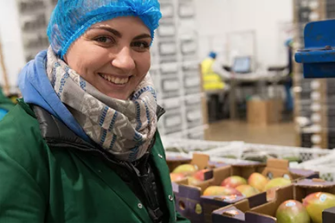 A Wealmoor team member at a packing facility