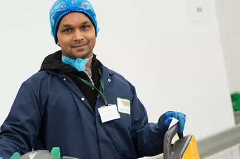 A Wealmoor team member at a packing facility